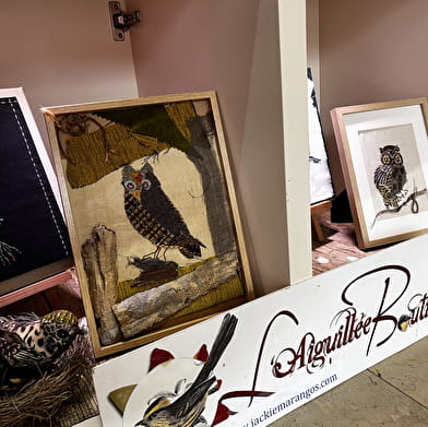 The birds of L'Aiguillée Studio in the window of the tourist office